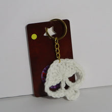 Load image into Gallery viewer, Golden Green Glow Crochet Skull Keychain
